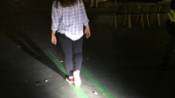 Woman walking straight line during DUI checkpoint