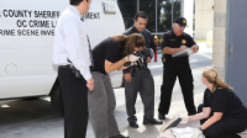 Orange County crime lab team inspecting evidence