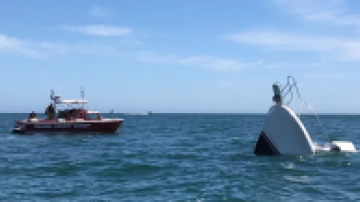 OCSD Harbor Patrol approaches a sinking boat