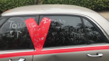 Vehicle with tape and writing on the windows