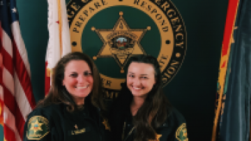 Officers Leslie and Katie pose for a picture