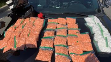 Narcotics investigators seized thousands of illicitly manufactured pills stamped as prescription pills.  