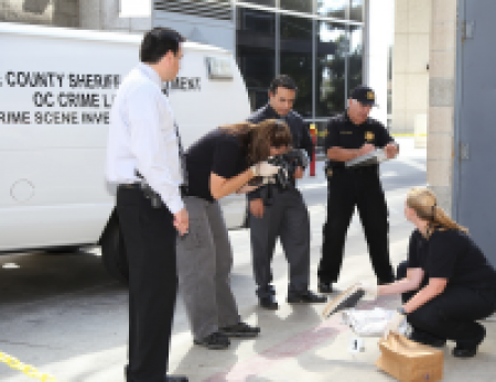 Orange County crime lab team inspecting evidence