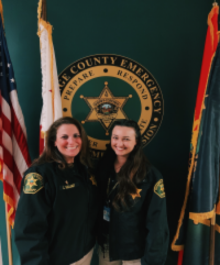 Officers Leslie and Katie pose for a picture