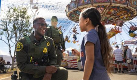 Photo of deputies with girl at OC Fair